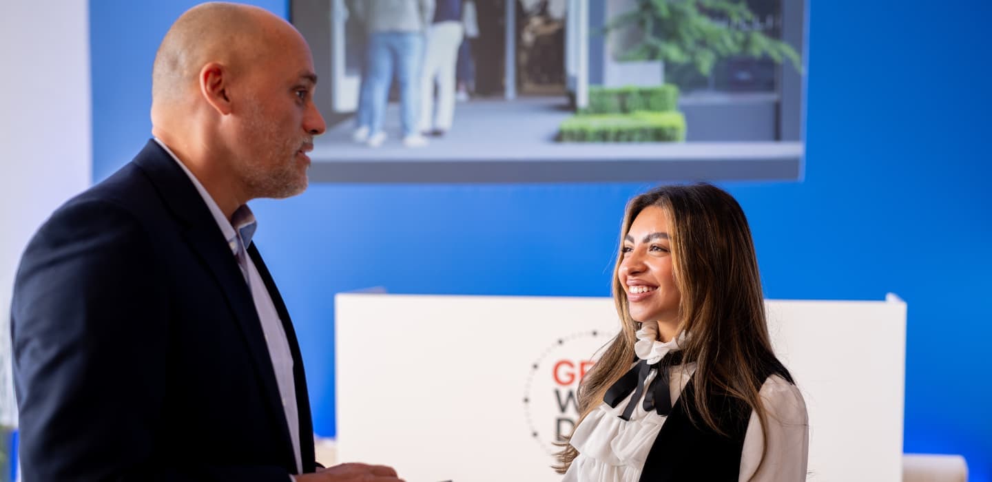 HIM Business School student speaking with CEO of a luxury company at Geneva Watch Days