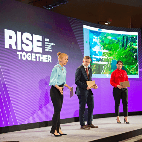 HIM Business School students presenting at the AHIC conference