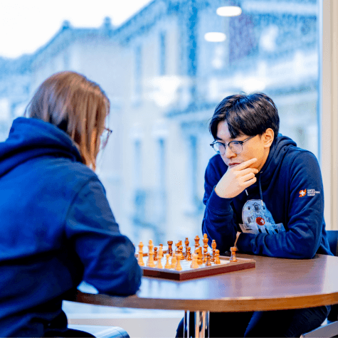 HIM Business School students using strategic skills to play chess